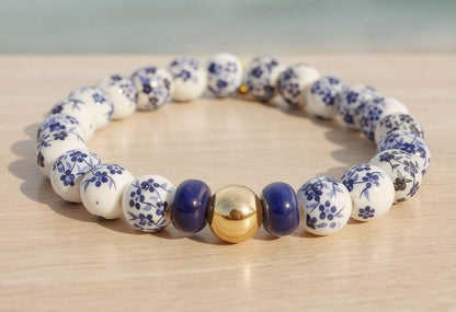 Bridal Party Gift Porcelain Bead Bracelet Blue White Floral Design Bridesmaid Jewelry Wedding Favor Present Ceramic Stretch Band Hand Painted Chinoiserie Pattern Gold Filled Accent Bead Elegant Accessory Adjustable Fit Boho Chic Style