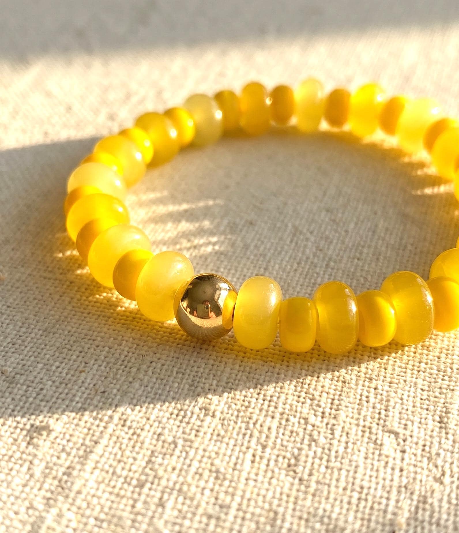 Stretch Glass Bracelet Ocean Color Beaded Jewelry Teal Rondelle Design With Gold Accent Bead Summer Style Accessory Stackable Everyday Wear Perfect Beach Vacation Gift Elastic Band Women Bracelet Coastal Jewelry Collection Comfortable Fit