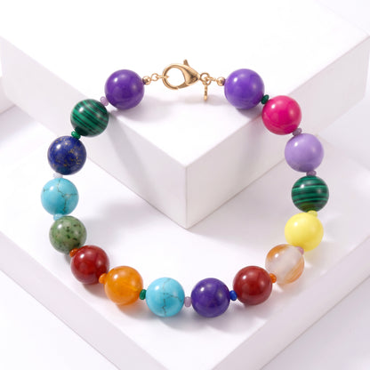 Robyn by design multi-colored beaded statement necklace with high-gloss spherical beads and gold-tone lobster clasp.