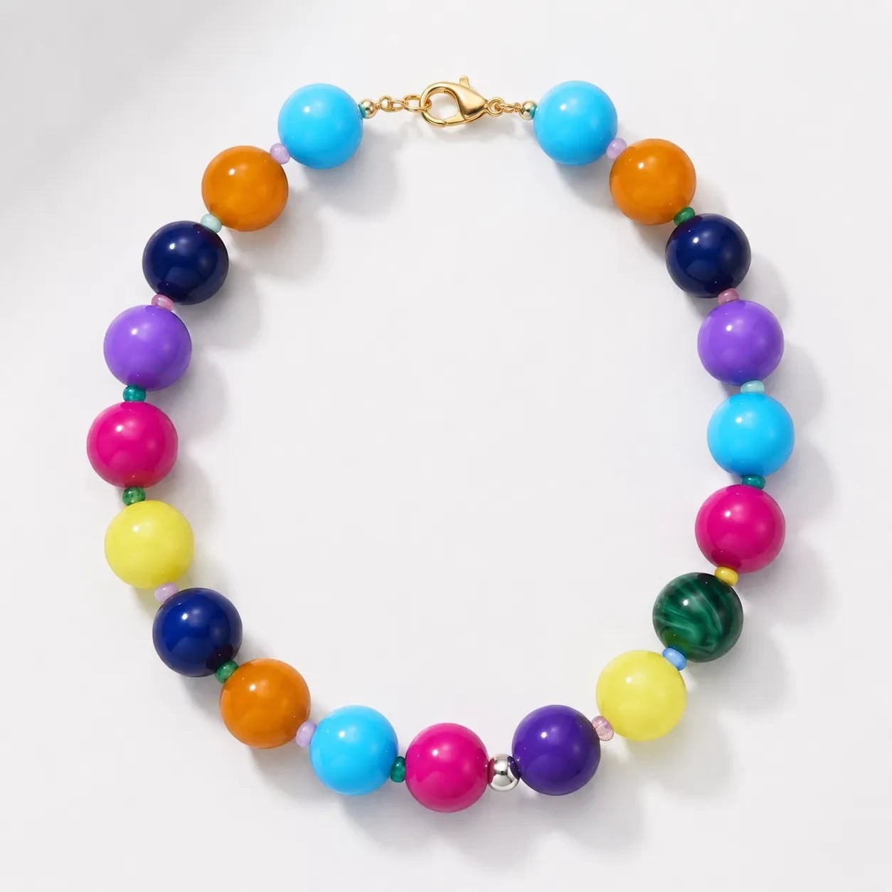Robyn by design multi-colored beaded statement necklace with high-gloss spherical beads and gold-tone lobster clasp.