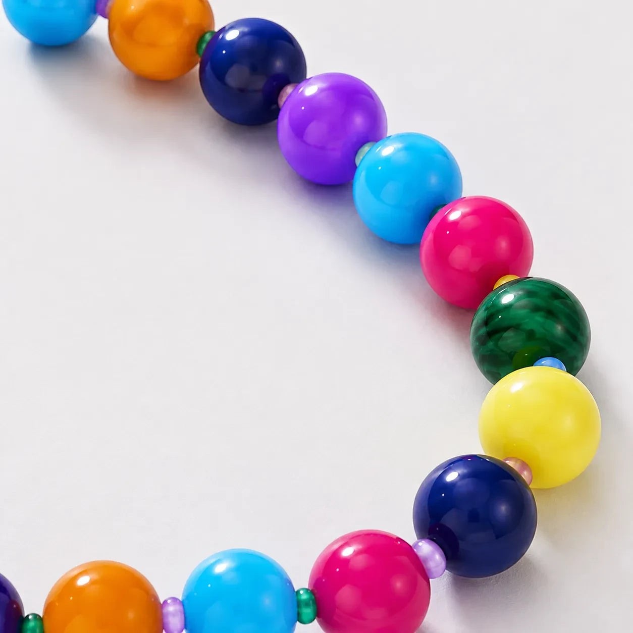 Robyn by design multi-colored beaded statement necklace with high-gloss spherical beads in vibrant rainbow hues.