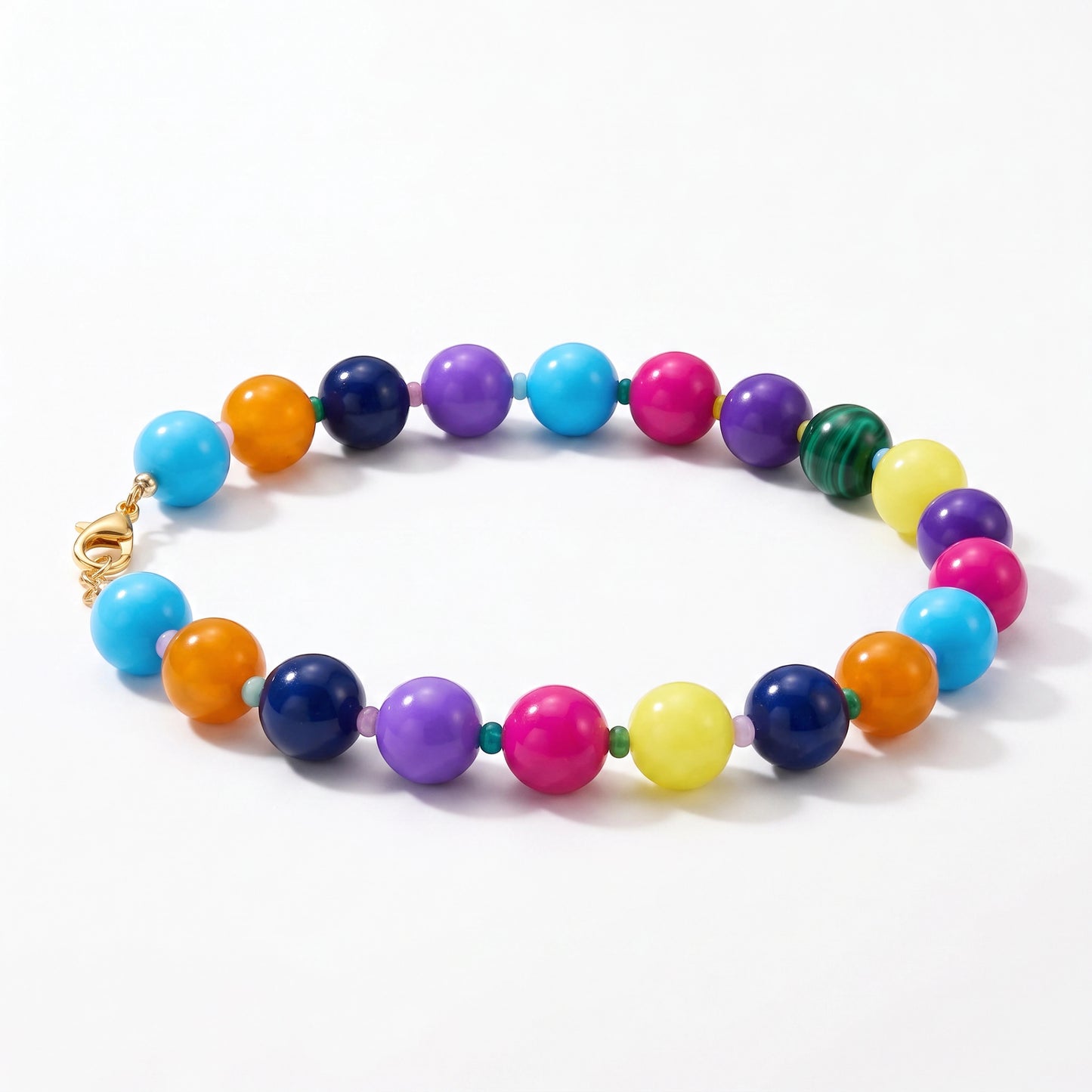 Robyn by design multi-colored beaded statement necklace with high-gloss spherical beads and gold-tone lobster clasp.